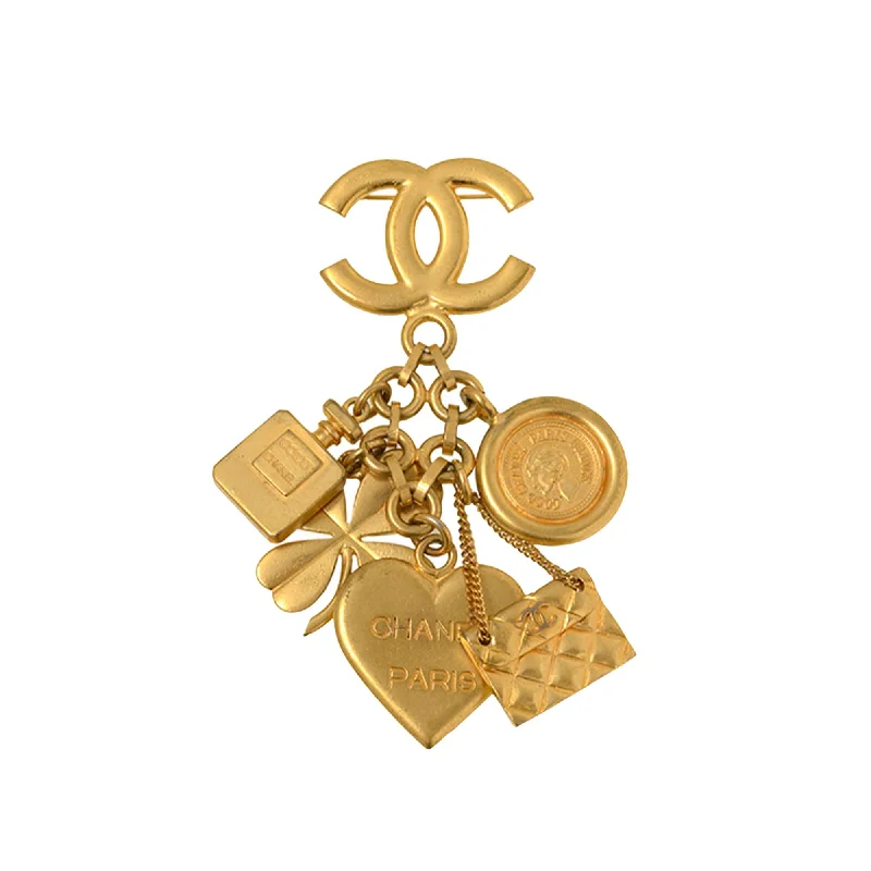 CHANEL accessories with gold-plated finishes -Chanel Icon Charms Pin Brooch (SHG-USIZCH)