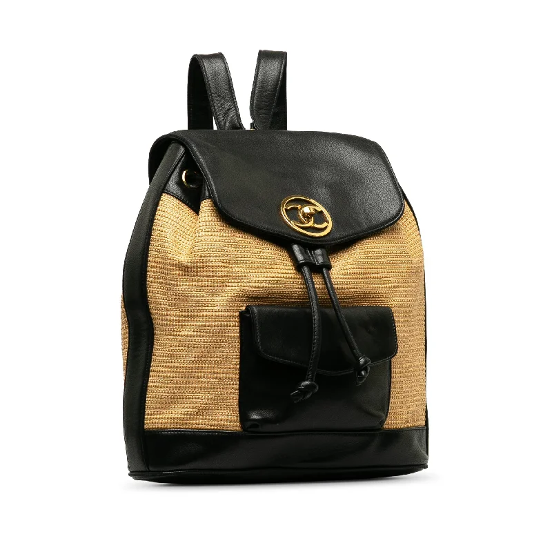 CHANEL bags with statement hardware -CHANEL CC Raffia and Leather Duma Backpack